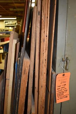 ASSORTED LUMBER LEANING AGAINST SHELVES