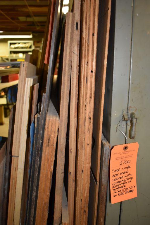 ASSORTED LUMBER LEANING AGAINST SHELVES