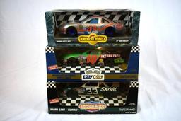 (3) 1/18" SCALE DIE CAST COLLECTORS CARS IN BOXES;