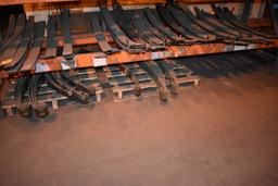 LARGE ASSORTMENT OF HELPER SPRINGS ON LOWER SHELF