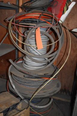 BOXES AND ROLLS OF ASSORTED TUBING AND AIR HOSE ON FLOOR