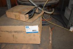 BOXES AND ROLLS OF ASSORTED TUBING AND AIR HOSE ON FLOOR