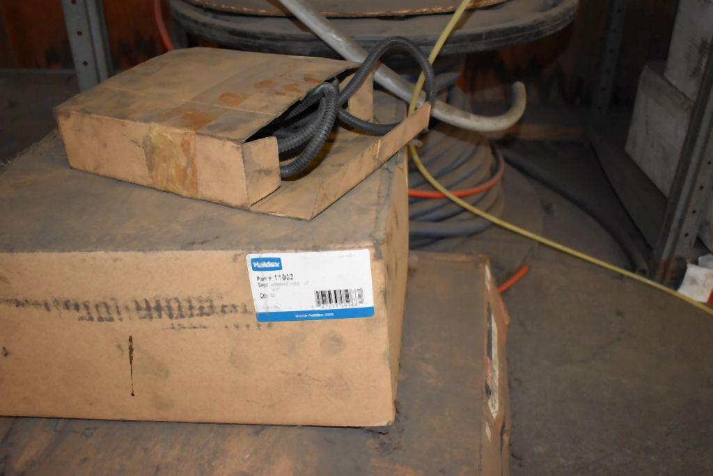 BOXES AND ROLLS OF ASSORTED TUBING AND AIR HOSE ON FLOOR