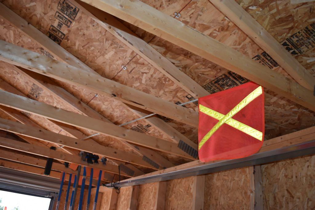 SAFETY FLAG, MOUNTS ON BACK OF TRUCK, LOCATED IN SHED