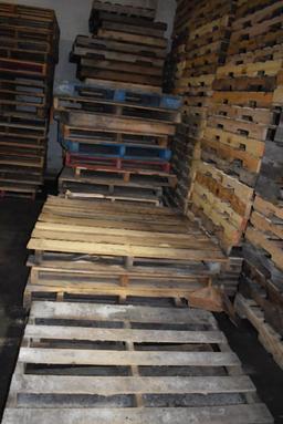 ROW OF (4) COLUMNS OF MISC. SIZE WOODEN PALLETS,
