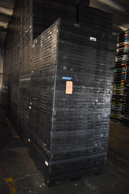 (7) COLUMNS OF NESTING PLASTIC PALLETS,