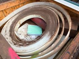 SKID BOX WITH MISC PLASTIC AND PLASTIC STRIP