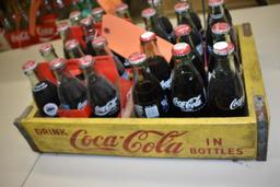 24 UNOPENED COMMERATIVE 8 OZ BOTTLES OF COKE