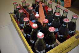 24 UNOPENED COMMERATIVE 8 OZ BOTTLES OF COKE
