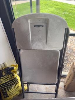 LOT WITH (3) TAN FOLDING CHAIRS, (1) LIFETIME WHITE FOLDING CHAIR AND FOLDING