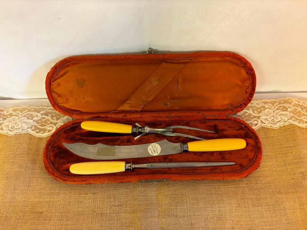 VICTORIAN CELLULOID HANDLED CARVING SET IN WOOD AND VELVET BOX