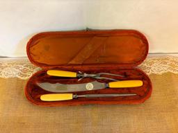 VICTORIAN CELLULOID HANDLED CARVING SET IN WOOD AND VELVET BOX