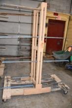 HOME MADE WOOD/METAL PIPE DRYING RACK, 4" CASTERS, 16 SECTIONS OF PIPE, 77"H X 58"L X 34"W