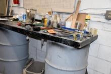 WORKBENCH TOP ON BARRELS W/CONTENTS: HAND TOOLS & MISC.