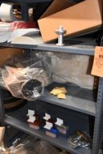 CONTENTS OF SHELVING UNIT: COFFINS, MOVIE PROJECTORS, SARDINE CAN, ETC.