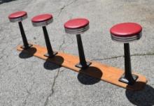 (4) VINTAGE BAR STOOLS WITH CAST BASE AND WOOD PLATFORM SODA FOUNTAIN