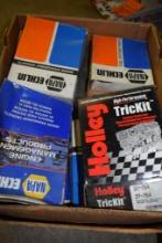 BOX OF VINTAGE AUTO LAMPS AND BULBS, CARBURETOR KITS, ETC.