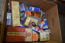BOX OF VINTAGE FUEL SYSTEM PARTS, RADIATOR CAPS, ELECTRICAL PARTS, ETC.