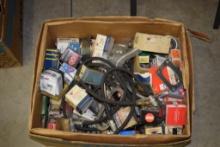 BOX OF VINTAGE AUTOMOTIVE BRAKE AND NOSE PARTS, RADIATOR CAPS, ETC.