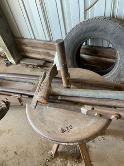 Tire changer unit with equipment is bolted to the ground