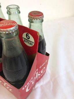 2 six pack Coca-Cola classic bottles