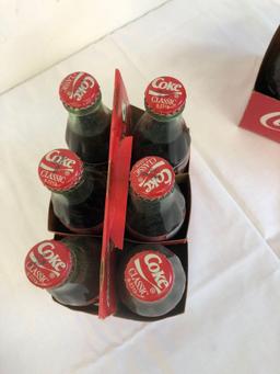 2 six pack Coca-Cola classic bottles