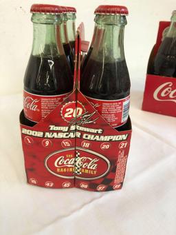 2 six pack Coca-Cola classic bottles