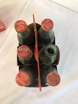 2 six pack Coca-Cola classic bottles