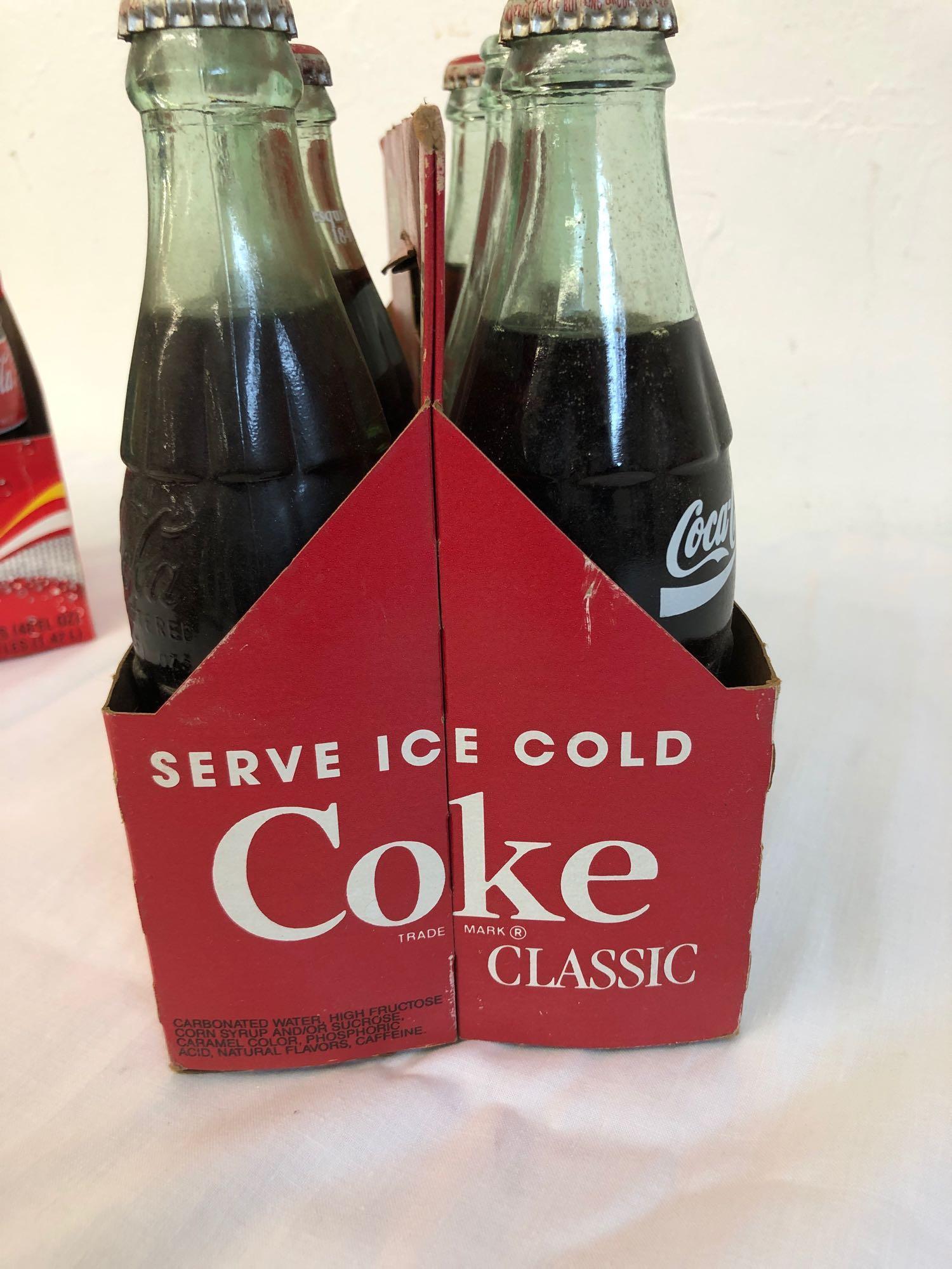 2 six pack Coca-Cola classic bottles