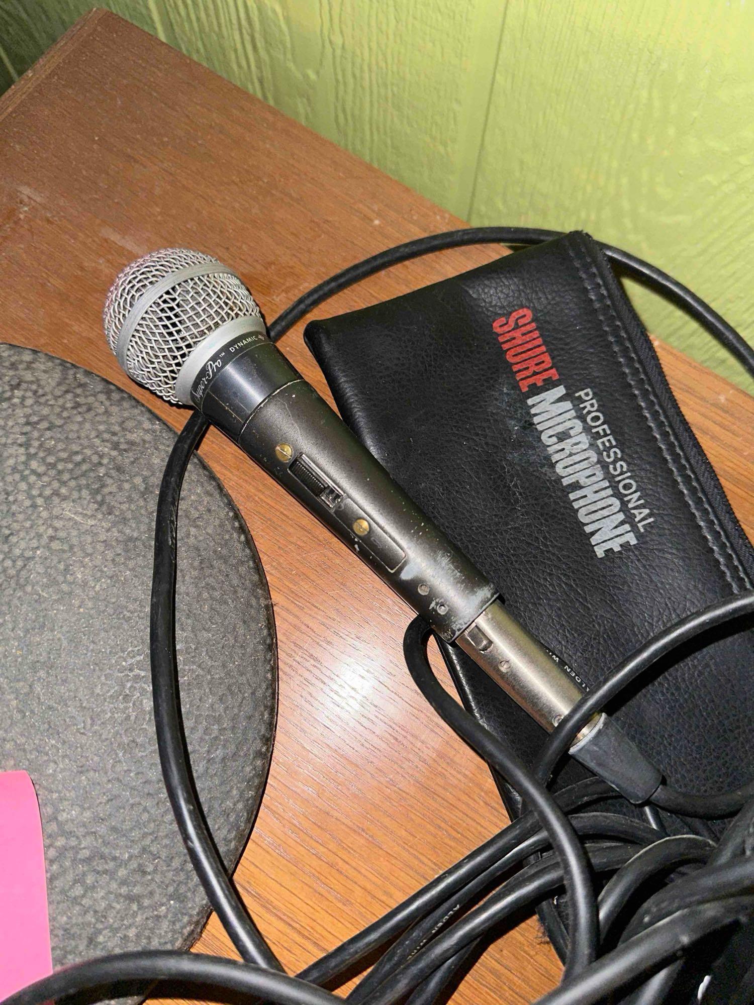 microphone with floor, stand cords, other electronics
