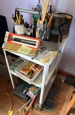 metal serving cart on wheels full of vintage art supplies