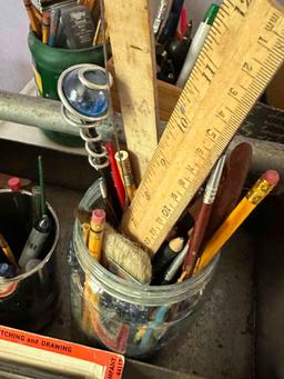 metal serving cart on wheels full of vintage art supplies