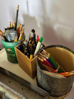 metal serving cart on wheels full of vintage art supplies