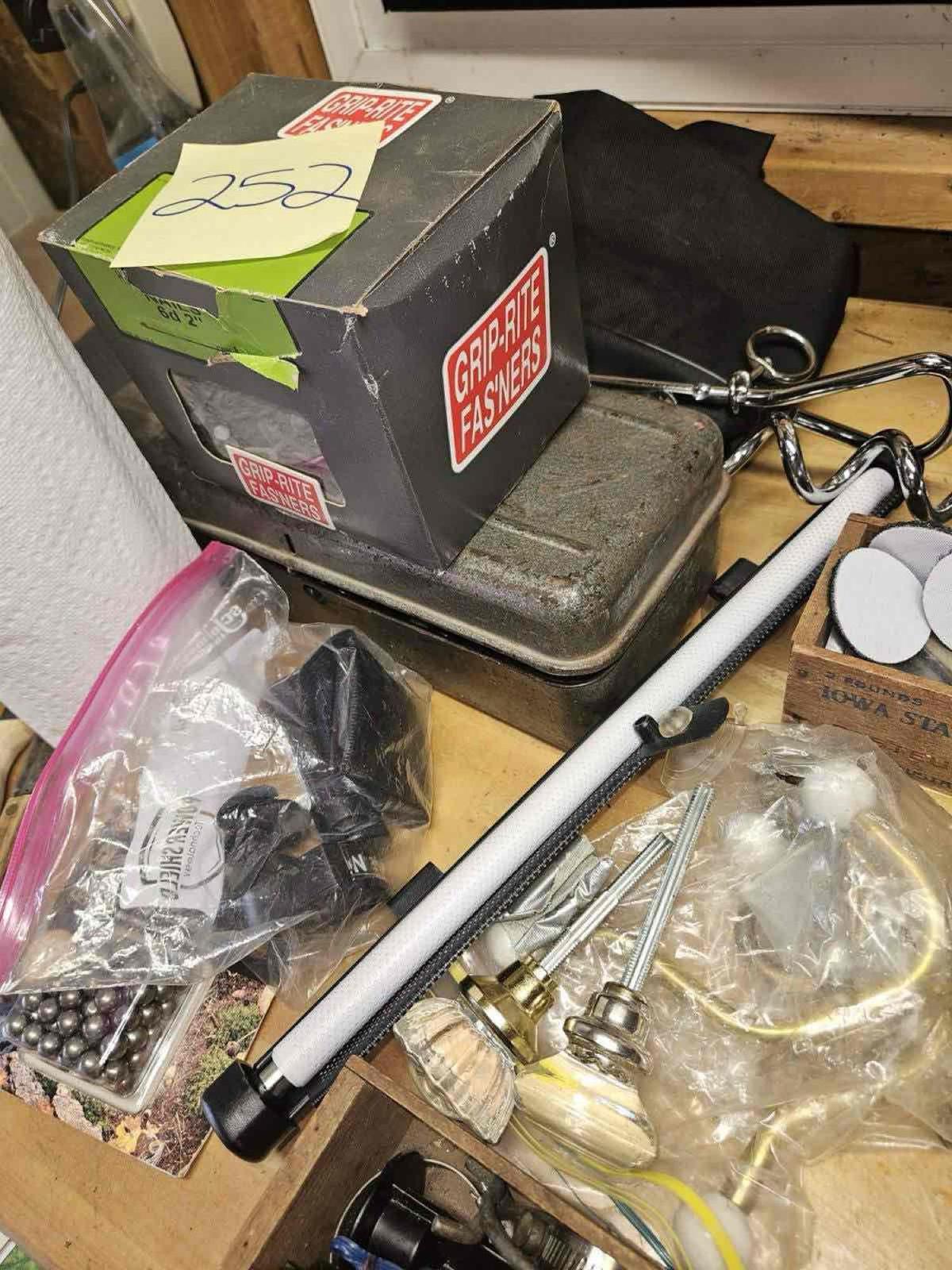 lot of collectibles and hardware. 1946 license plate, lamp, glass door knobs etc