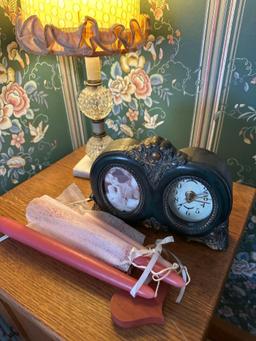 bedside cupboard with two small drawers, lamp, clock, etc.