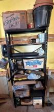 shelf of parts bench grinder vintage cans and misc