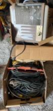 box full of extension cords and Titian portable electric heater