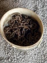 5 gallon bucket full of log chains