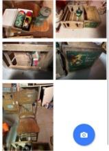 small lantern and lunch tin with crates and chair