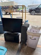 TV, television, heater, and laundry basket