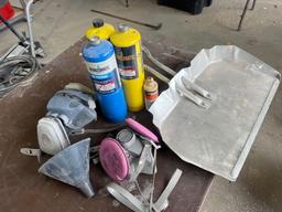 dustpan, propane tanks, masks