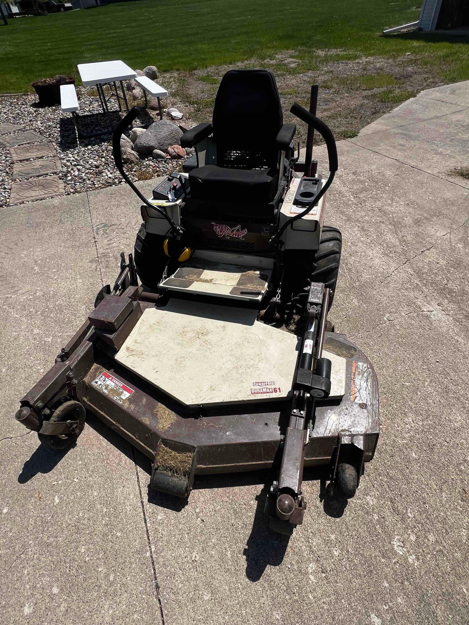 Grasshopper 727k zero turn with 61 inch deck and 887 hours runs and operates good