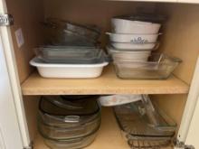 Cabinet full of baking dishes and pans
