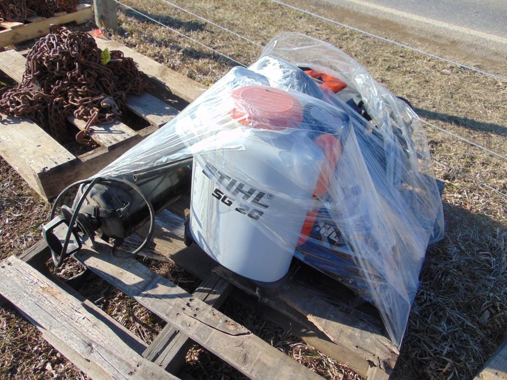 Pallet of lawn sprayers and backpack leaf blowers
