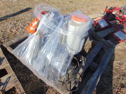 Pallet of lawn sprayers and backpack leaf blowers