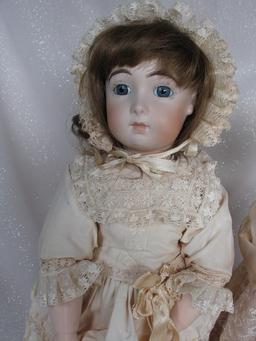Four reproduction porcelain dolls:- Jumeau long face Bebe 43cm on compositi