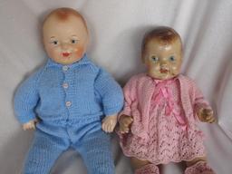 Two weary 1940s composition dolls:- Boy 51cm with lifting paint around mout