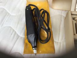 Two Dremel tools
