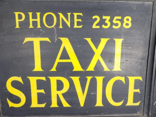 Early Wooden Taxi Service Sign