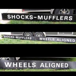 Shocks, Mufflers, Wheels Aligned Sign